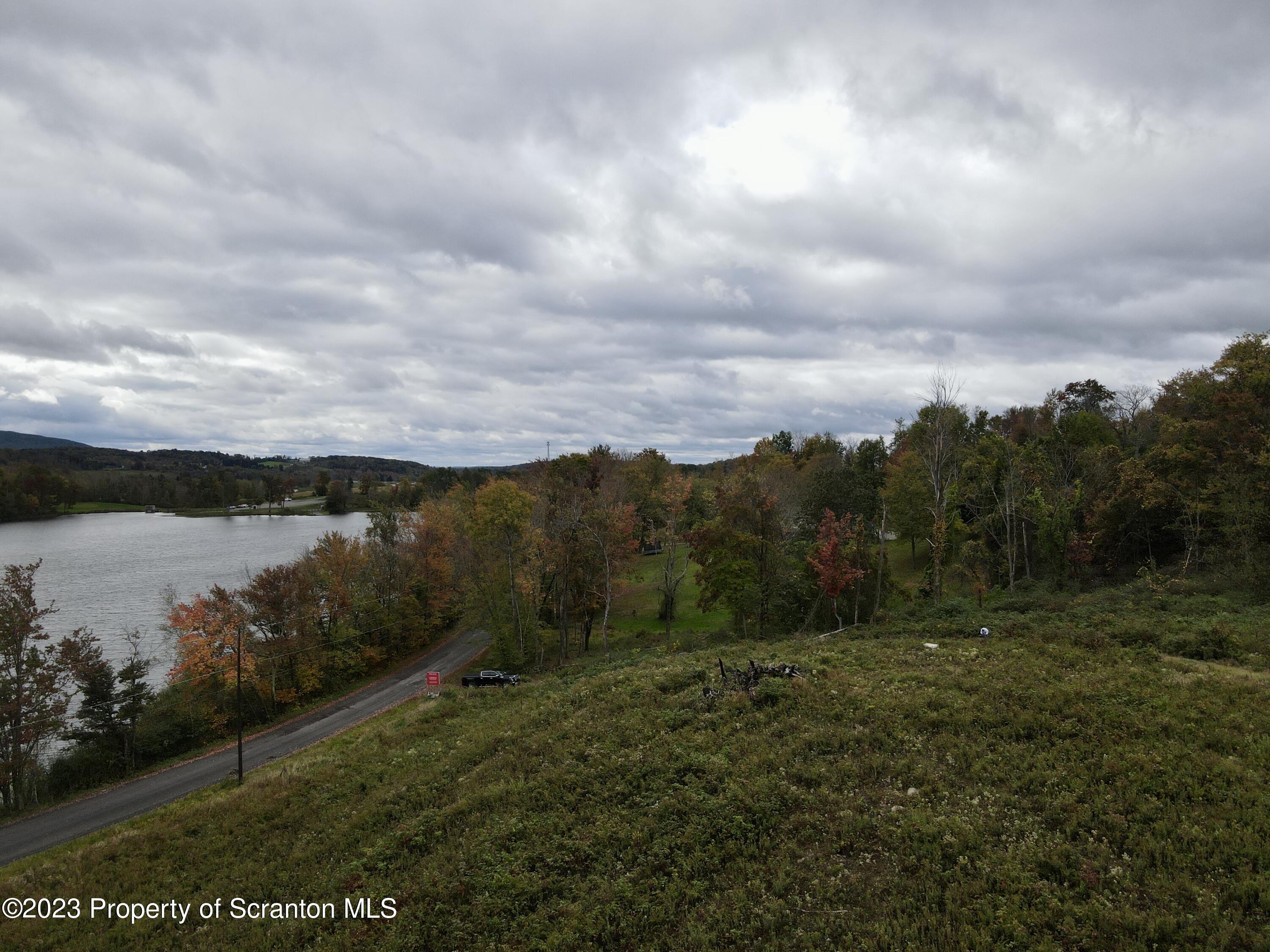 Fords Pond Road Dalton, PA 18414 - Photo 5 of 9 a view of a lake with a yard