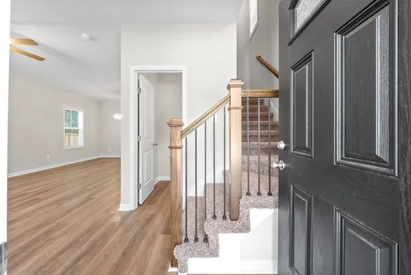 a view of entryway with wooden floor