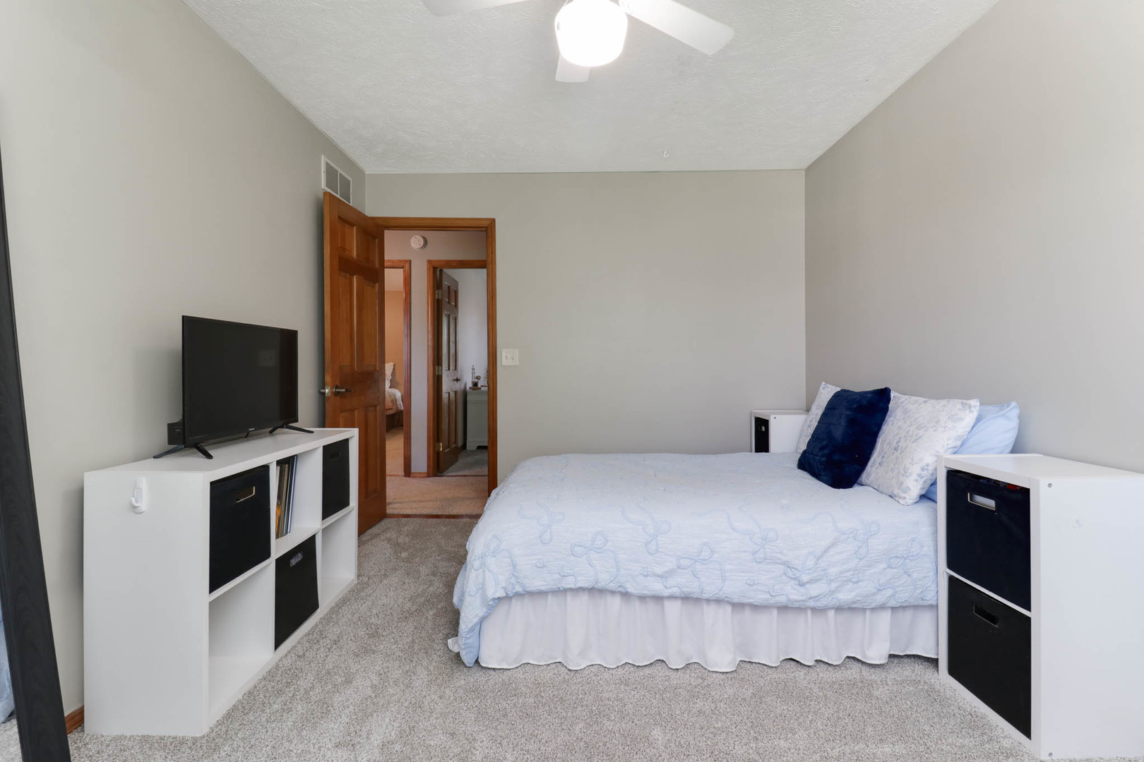 3203 Eagle Crest Road Bloomington, IL 61704 - Photo 26 of 52 a bedroom with a bed and a flat screen tv