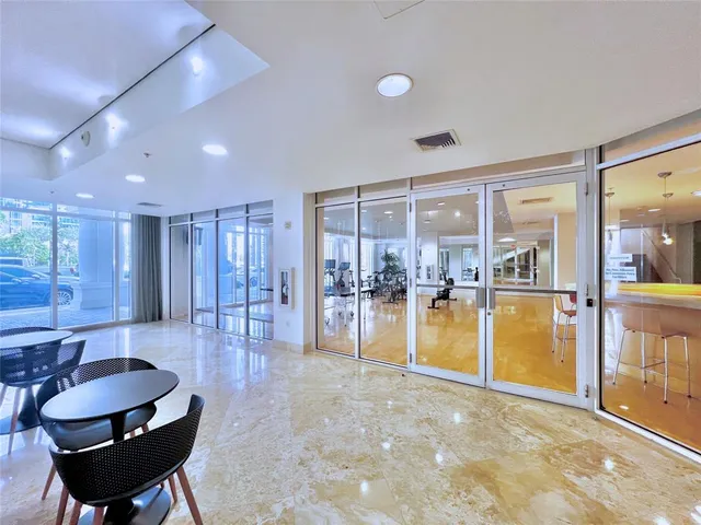 a view of a backyard with plants and lake view