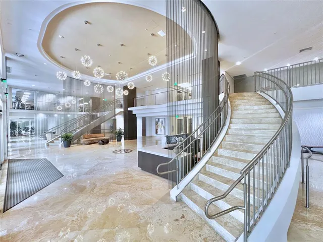 a view of a house with pool and sitting area