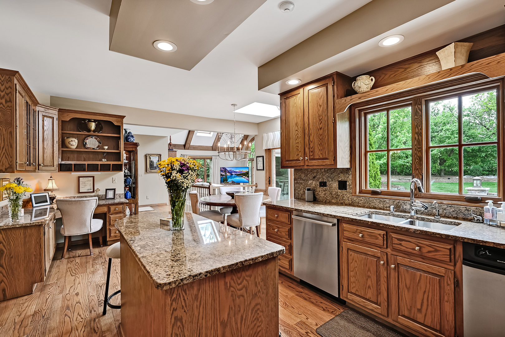 2 Hampton Court Burr Ridge, IL 60527 - Photo 12 of 38 a kitchen with lots of counter top space and wooden floor
