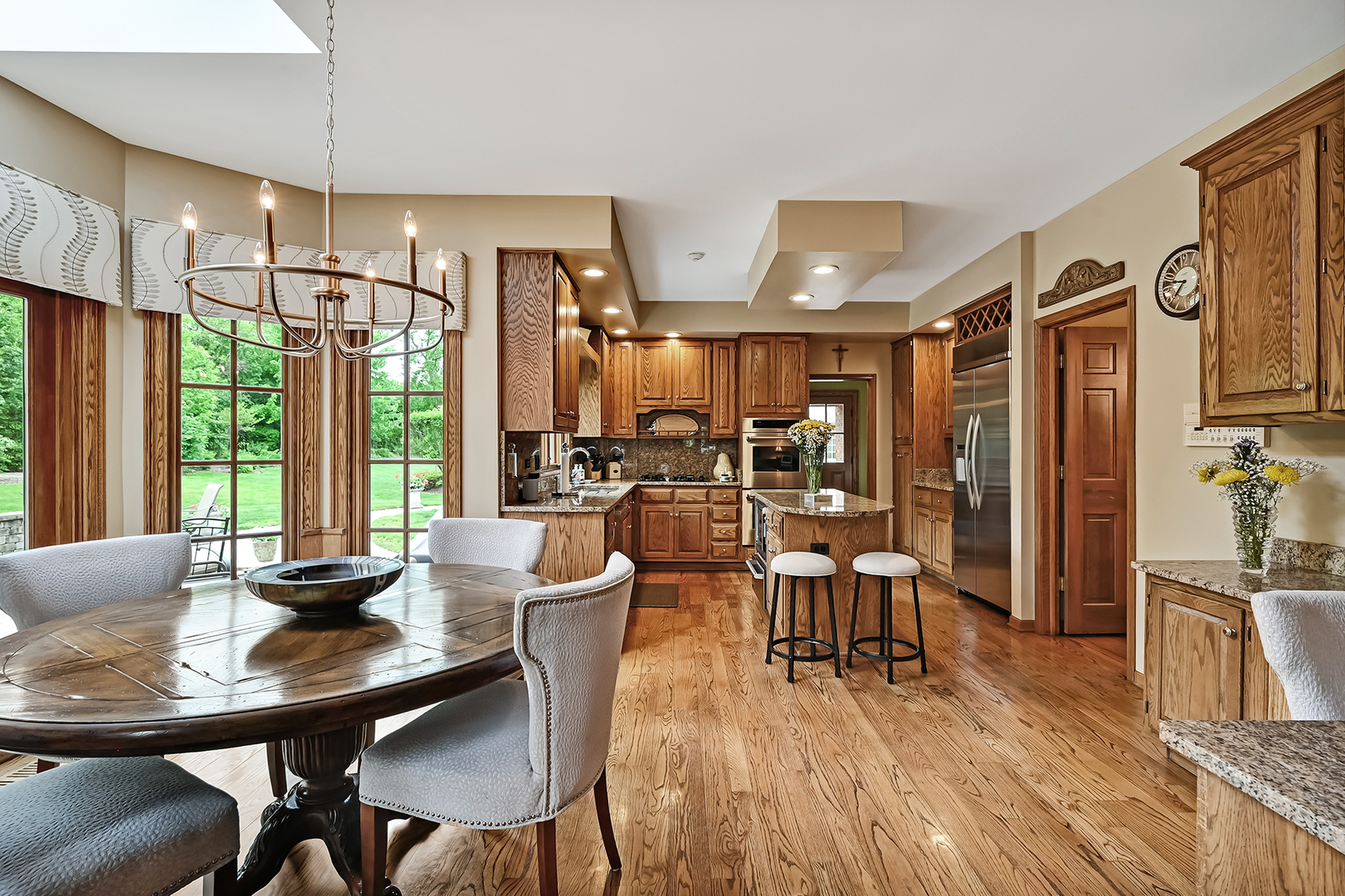 2 Hampton Court Burr Ridge, IL 60527 - Photo 13 of 38 a dining room with furniture window and wooden floor