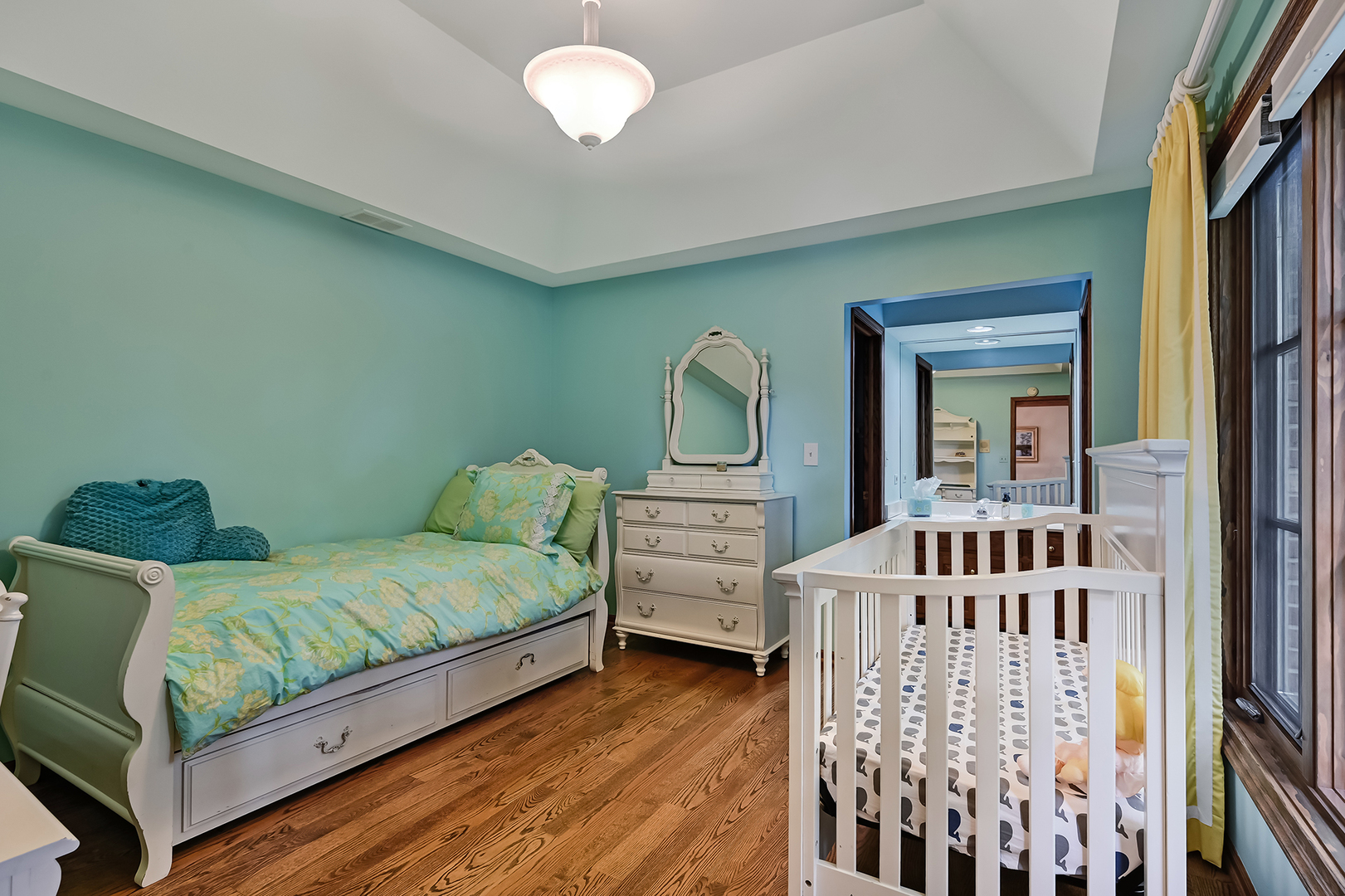 2 Hampton Court Burr Ridge, IL 60527 - Photo 26 of 38 a bedroom with furniture and a large window