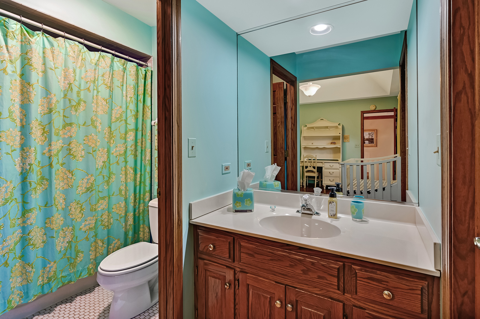 2 Hampton Court Burr Ridge, IL 60527 - Photo 27 of 38 a bathroom with a sink a toilet and a mirror