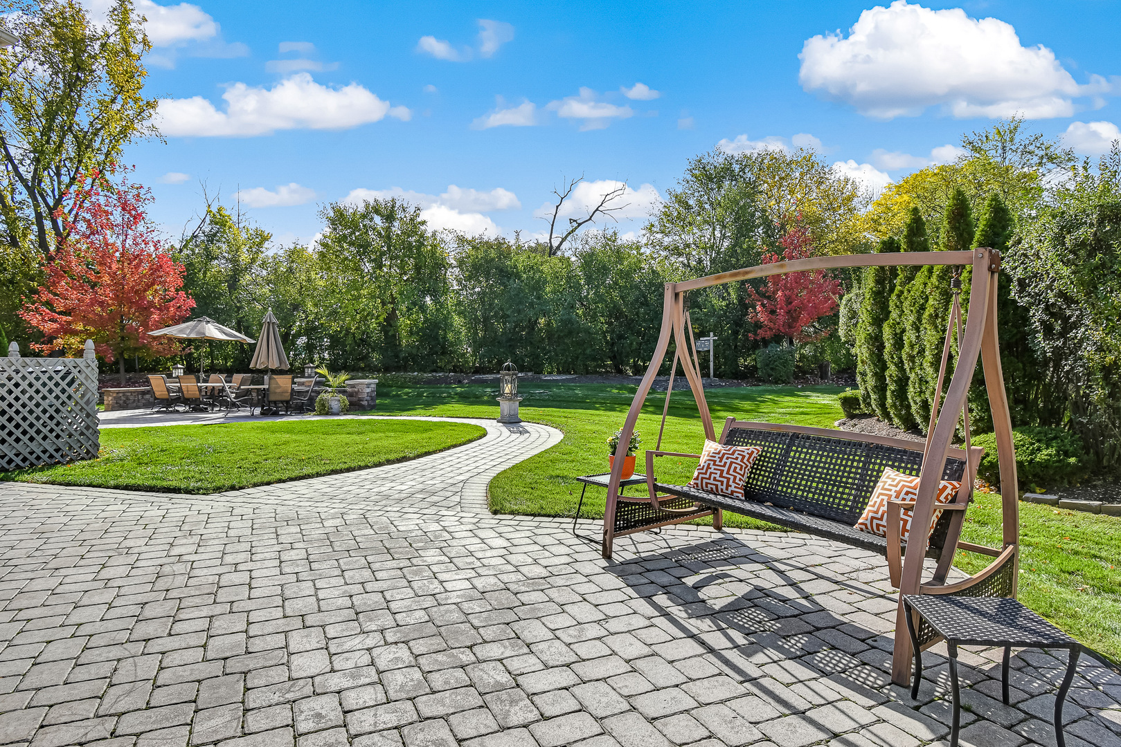 2 Hampton Court Burr Ridge, IL 60527 - Photo 35 of 38 a view of a bench in a backyard