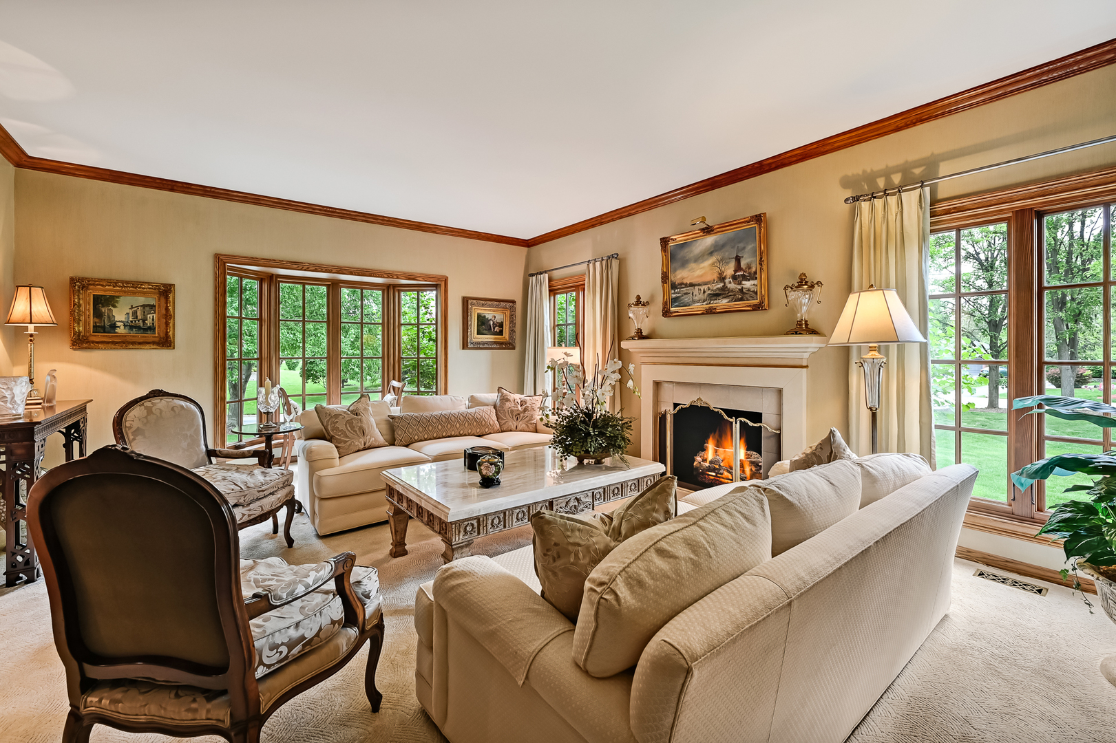 2 Hampton Court Burr Ridge, IL 60527 - Photo 5 of 38 a living room with furniture a fireplace and floor to ceiling windows