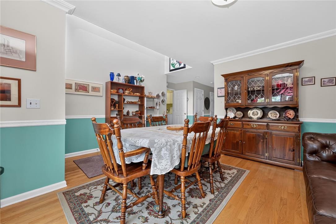 198 Park Ridge Drive Easton, PA 18040 - Photo 5 of 28 Hardwood floors and crisp wainscoting define this formal dining space, perfect for entertaining.