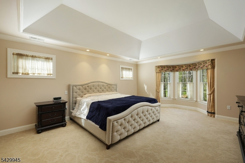 72 Mine Brook Road Bernards, NJ 07931 - Photo 13 of 28 a spacious bedroom with a bed and a window