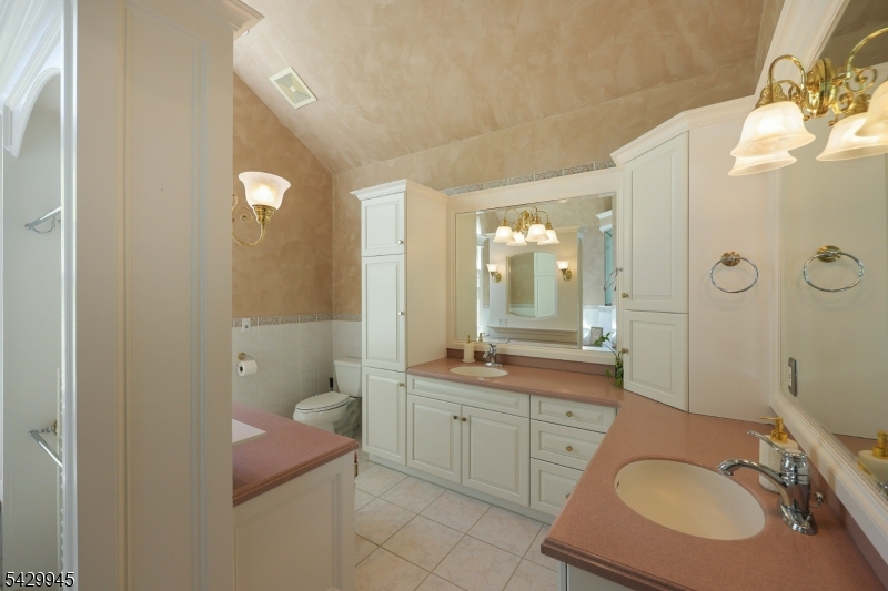 72 Mine Brook Road Bernards, NJ 07931 - Photo 15 of 28 a bathroom with a sink double vanity granite tub shower and a mirror