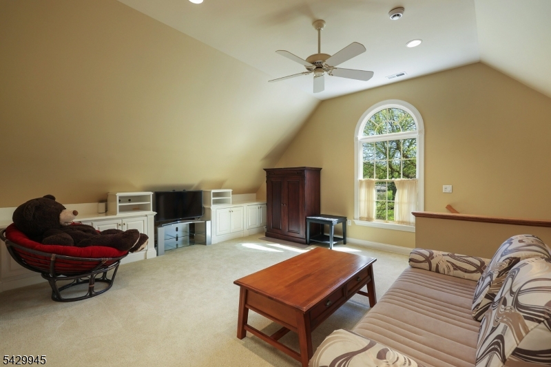 72 Mine Brook Road Bernards, NJ 07931 - Photo 20 of 28 a living room with furniture gym equipment and a window