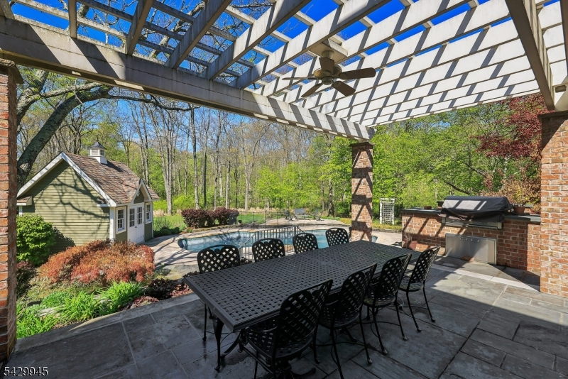 72 Mine Brook Road Bernards, NJ 07931 - Photo 24 of 28 a view of a patio with table and chairs and potted plants