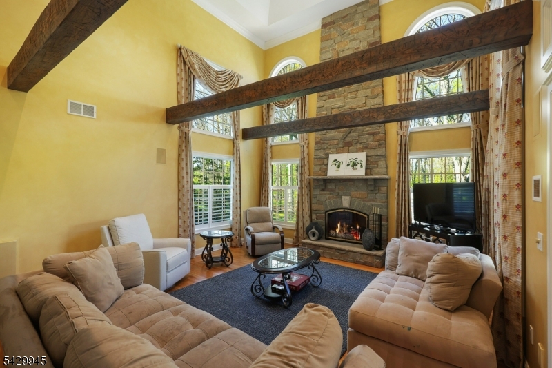 72 Mine Brook Road Bernards, NJ 07931 - Photo 4 of 28 a living room with furniture or fireplace and a floor to ceiling window