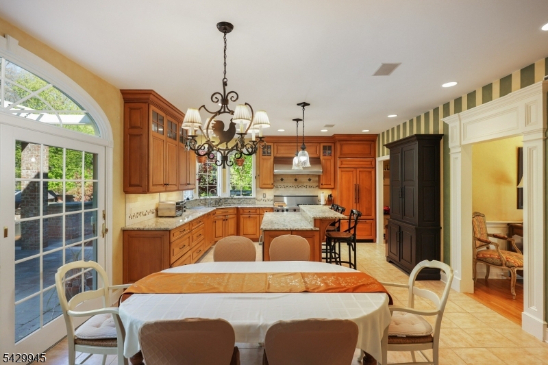 72 Mine Brook Road Bernards, NJ 07931 - Photo 5 of 28 a outdoor dining space with furniture a chandelier and wooden floor
