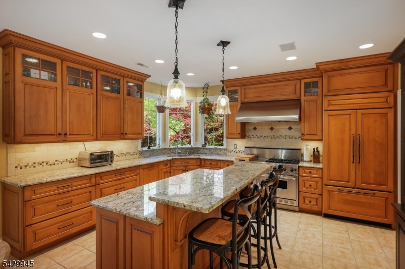 72 Mine Brook Road Bernards, NJ 07931 - Photo 6 of 28 a kitchen with a table chairs sink and cabinets