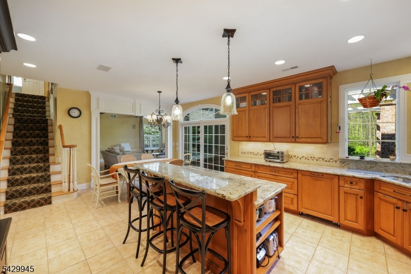 72 Mine Brook Road Bernards, NJ 07931 - Photo 7 of 28 a view of a kitchen with kitchen island granite countertop a table and chairs in it
