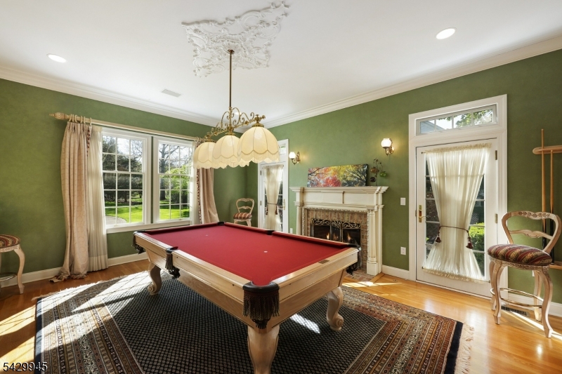 72 Mine Brook Road Bernards, NJ 07931 - Photo 8 of 28 a dining room with furniture a chandelier and wooden floor