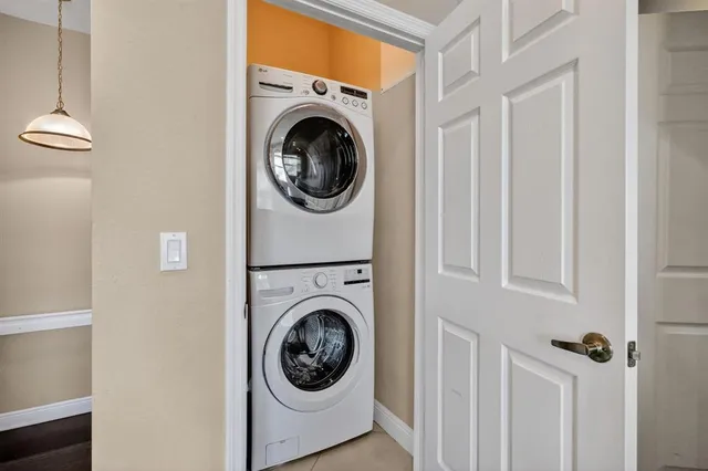 a view of a hallway with washer and dryer