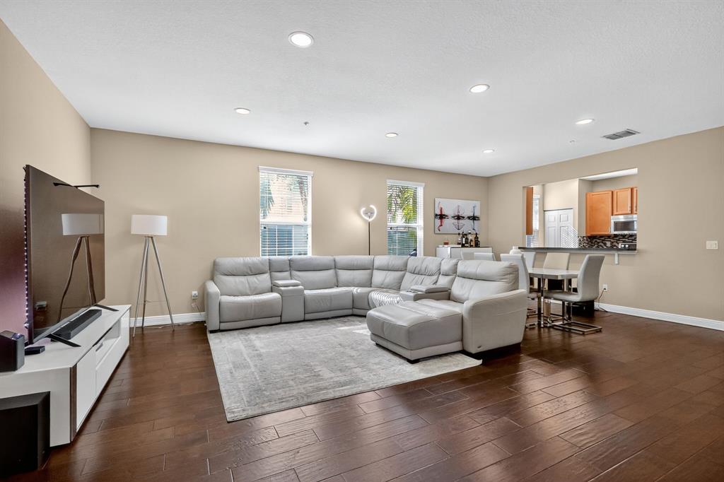 2669 Southwest 118 Road Miramar, FL 33025 - Photo 2 of 28 a living room with furniture flat screen tv and wooden floor