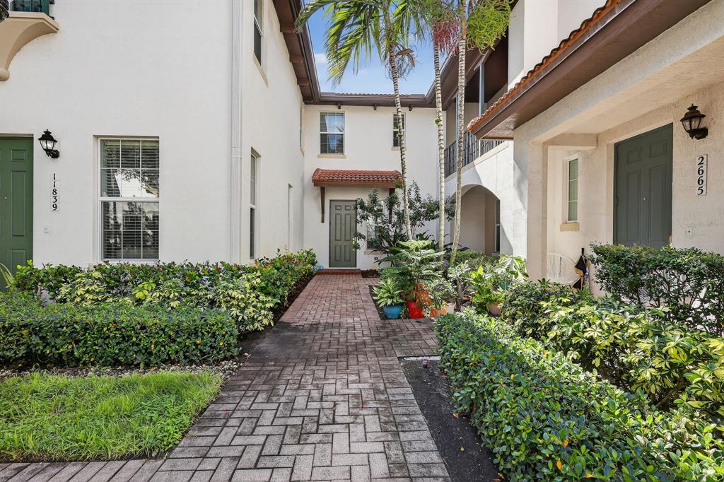 2669 Southwest 118 Road Miramar, FL 33025 - Photo 22 of 28 a front view of a house with a yard