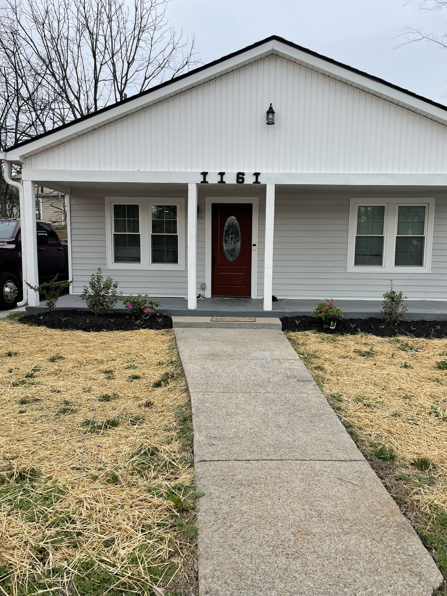 a front view of a house with a yard