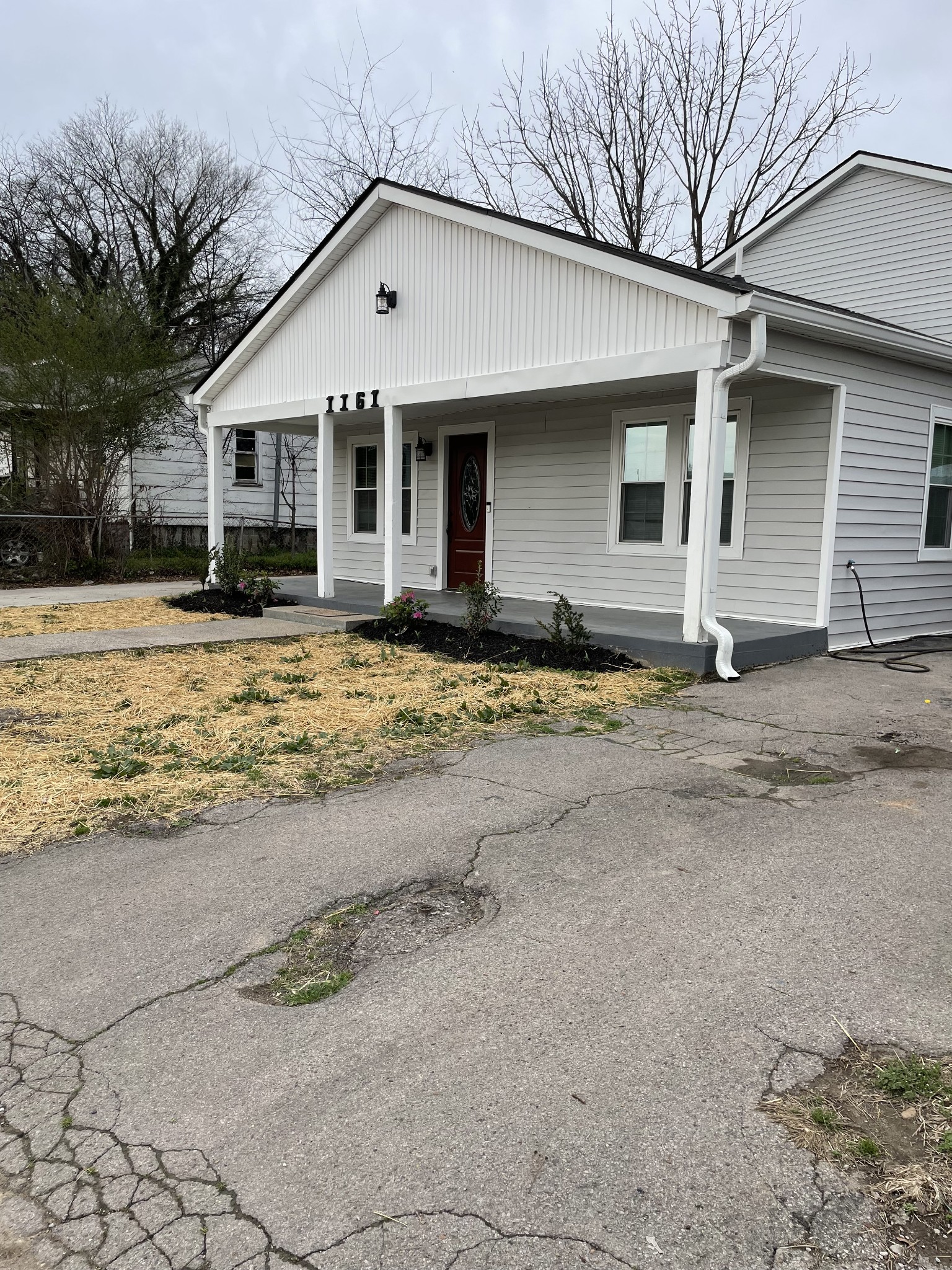 1161 Main Street Clarksville, TN 37040 - Photo 15 of 26 a front view of a house with a yard