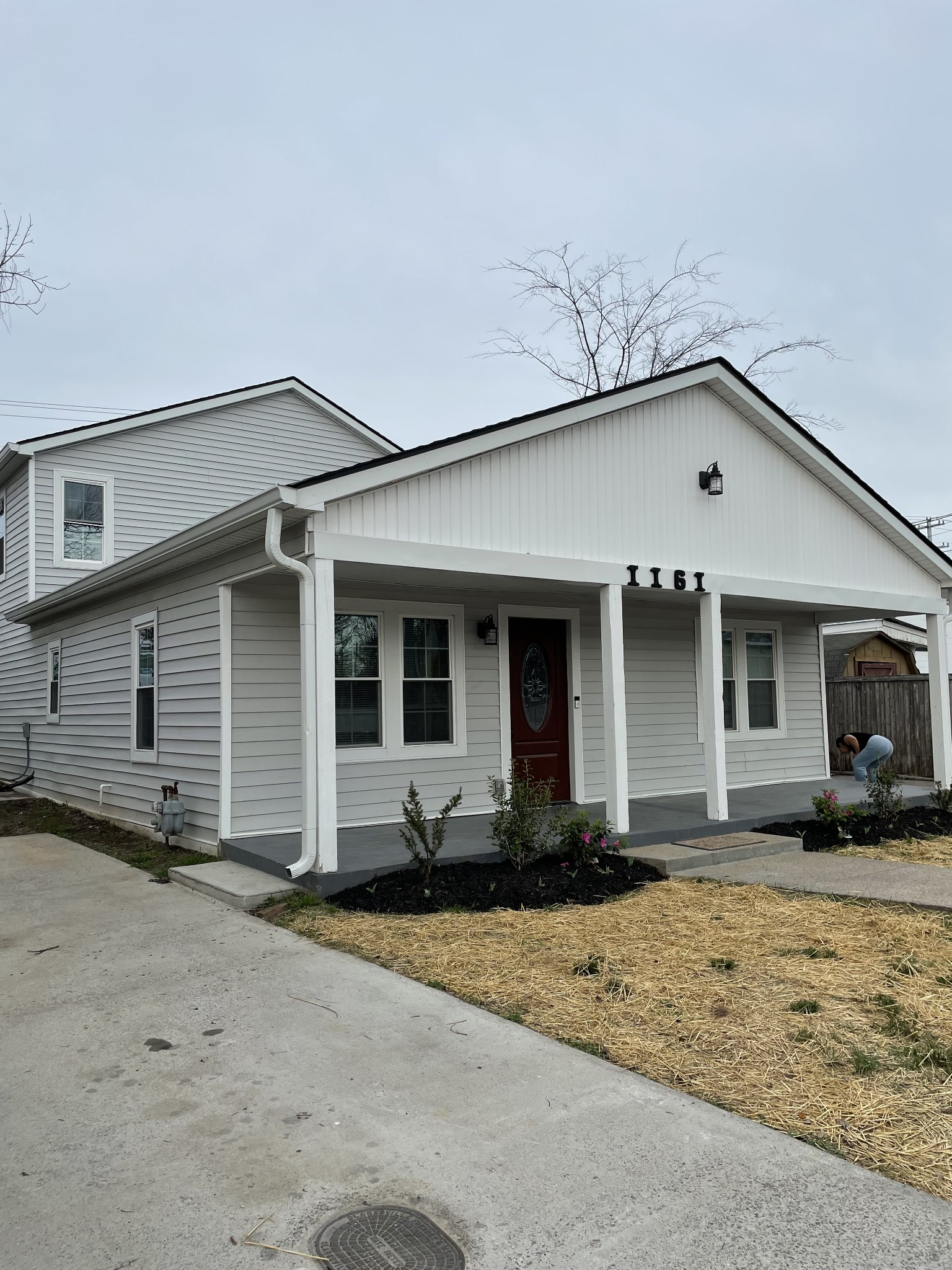1161 Main Street Clarksville, TN 37040 - Photo 16 of 26 a front view of a house with yard and seating space