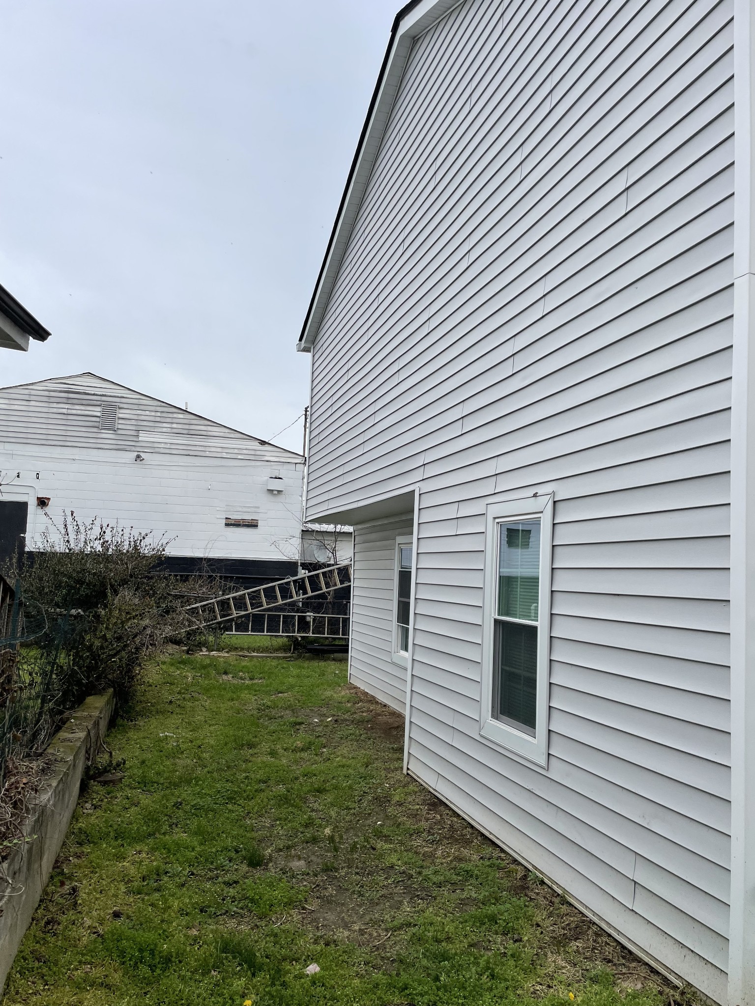 1161 Main Street Clarksville, TN 37040 - Photo 22 of 26 a view of a white house with a yard and a large window