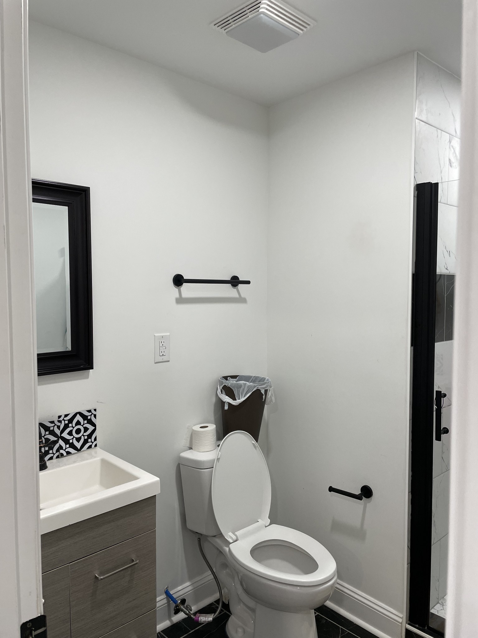 1161 Main Street Clarksville, TN 37040 - Photo 5 of 26 a bathroom with a toilet a sink and a mirror
