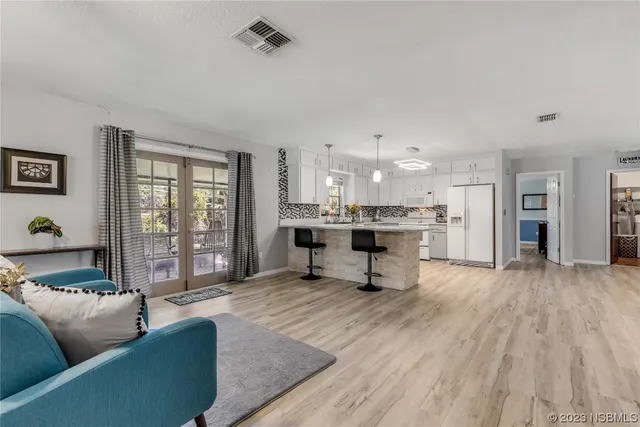 a living room with furniture and a table