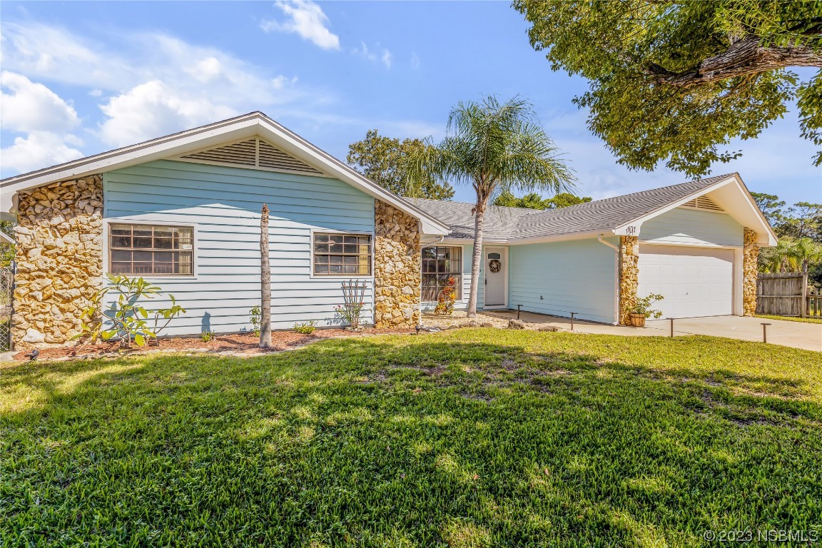 131 Silver Circle Edgewater, FL 32141 - Photo 2 of 30 a front view of a house with a yard