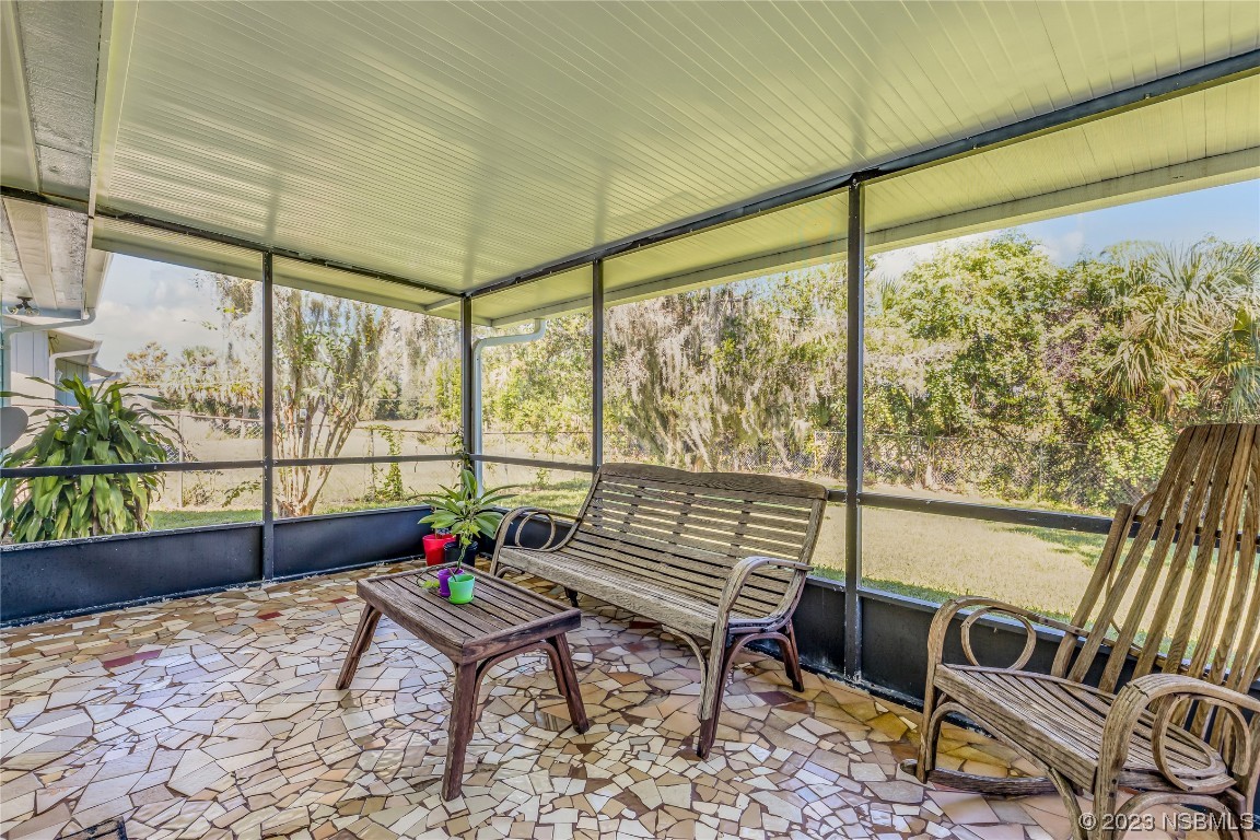 131 Silver Circle Edgewater, FL 32141 - Photo 22 of 30 a living room with furniture and a window