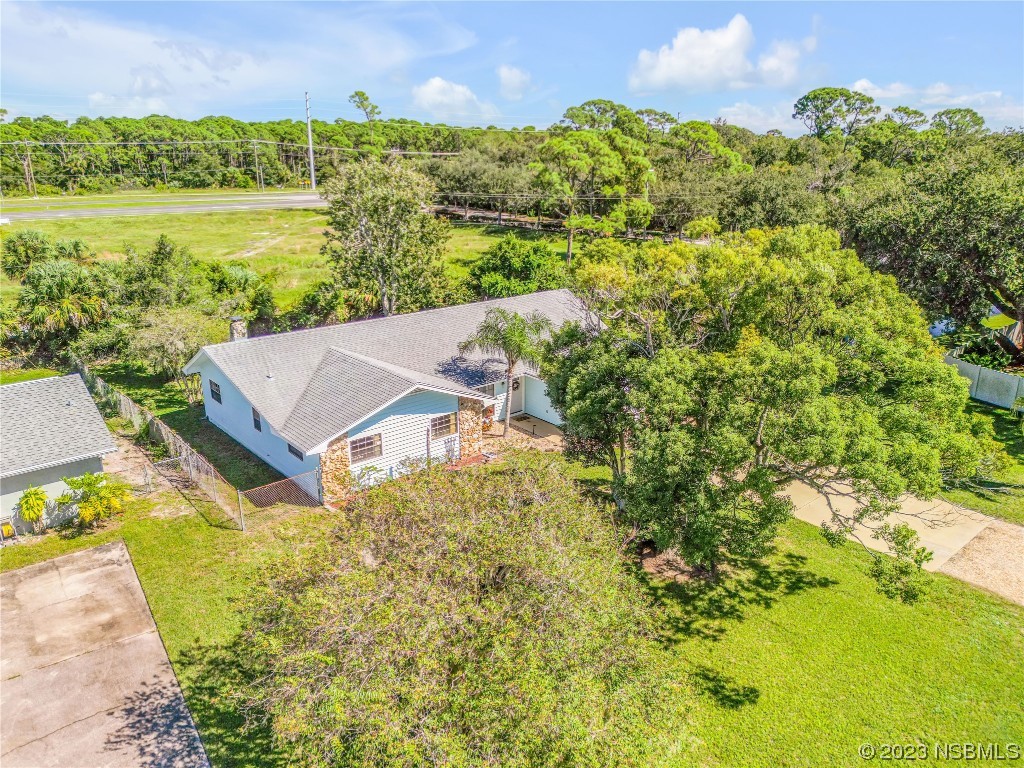 131 Silver Circle Edgewater, FL 32141 - Photo 27 of 30 a view of a lake with a house in the background