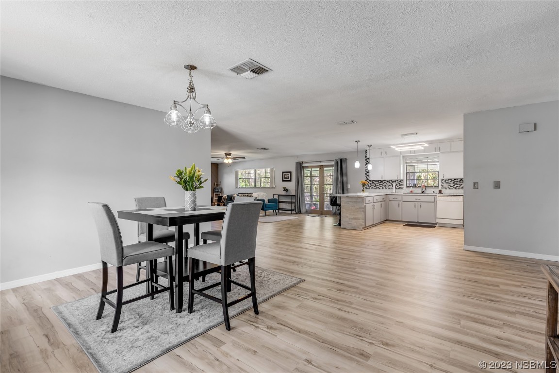 131 Silver Circle Edgewater, FL 32141 - Photo 5 of 30 a view of a dining room with furniture and wooden floor
