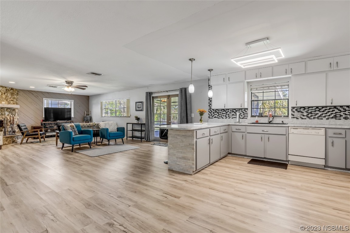 131 Silver Circle Edgewater, FL 32141 - Photo 6 of 30 a kitchen with stainless steel appliances sink cabinets and wooden floor