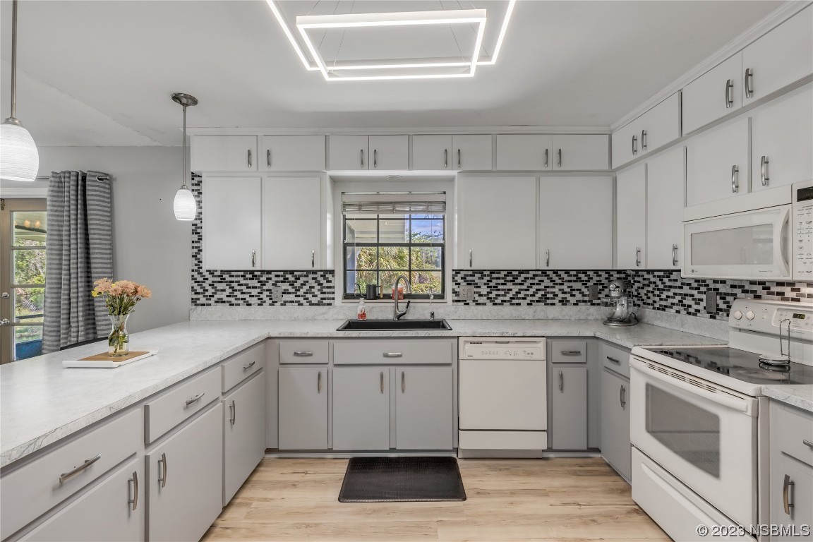 131 Silver Circle Edgewater, FL 32141 - Photo 9 of 30 a kitchen with a sink stove and cabinets