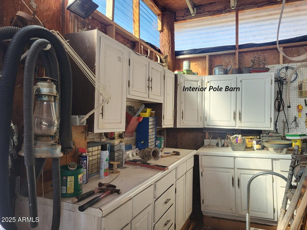 21750 North Ranch Road Williams, AZ 86046 - Photo 22 of 30 a room with lots of appliances and cabinets