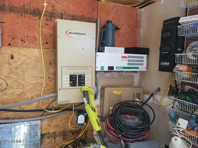 a view of a house with backyard water fountain and sitting area