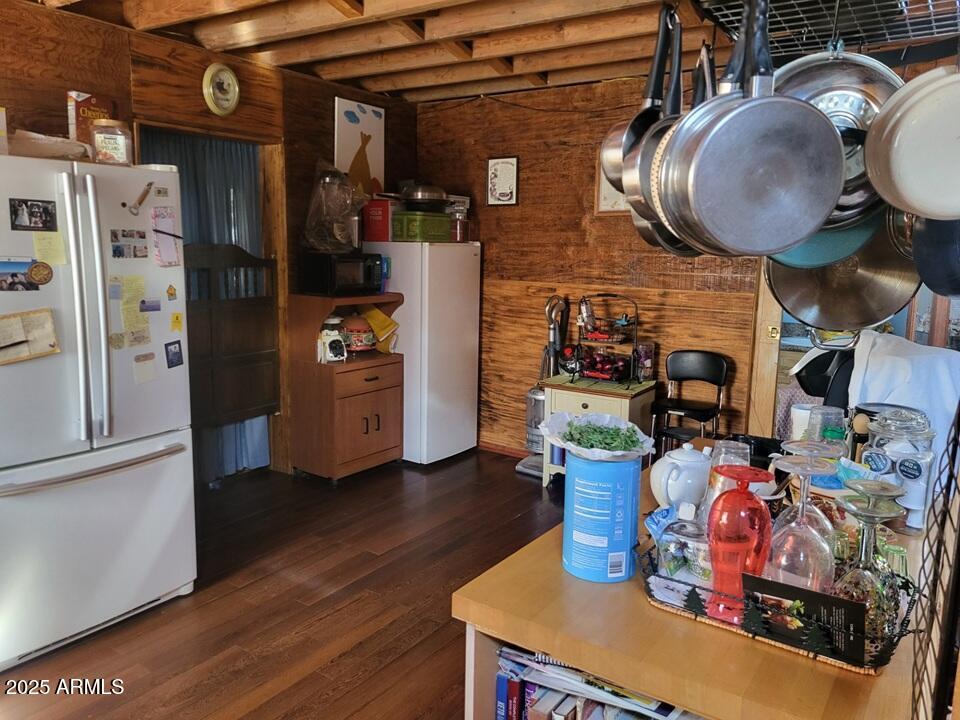 21750 North Ranch Road Williams, AZ 86046 - Photo 8 of 30 a kitchen with stainless steel appliances granite countertop a stove refrigerator and a wooden floor