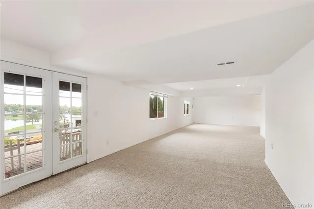 a view of game room with windows