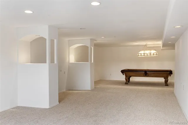a view of backyard with deck and wooden floor