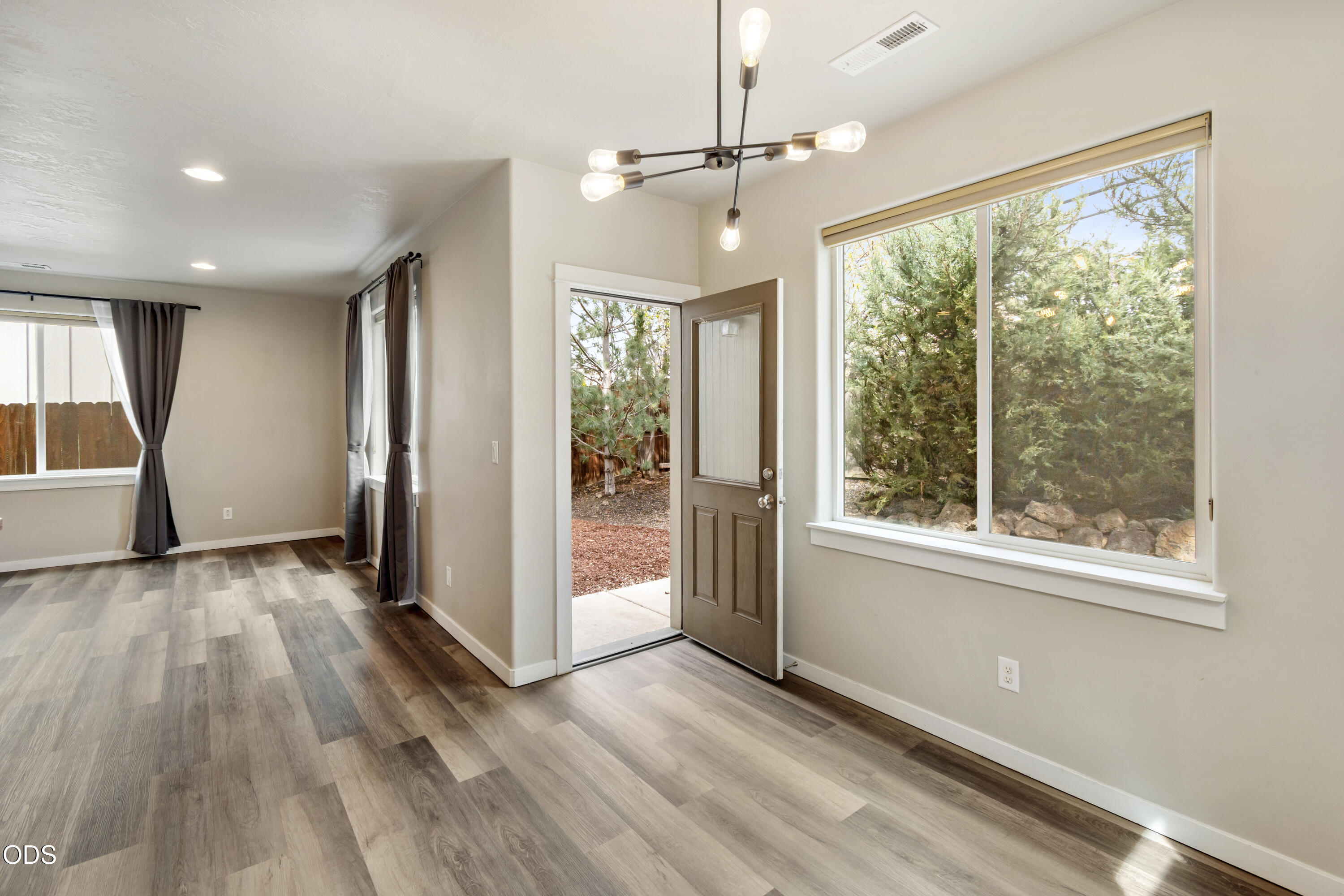21332 Oconnor Way Bend, OR 97701 - Photo 4 of 33 a view of livingroom with hardwood floor and window