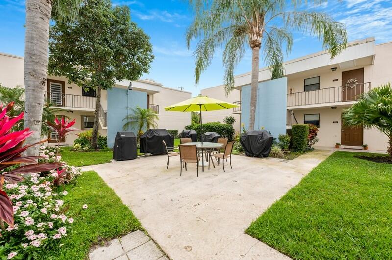 509 Dotterel Road, Unit 23C Delray Beach, FL 33444 - Photo 14 of 15 15_509DotterelRd_Apt23C_345_BarbequePicn
