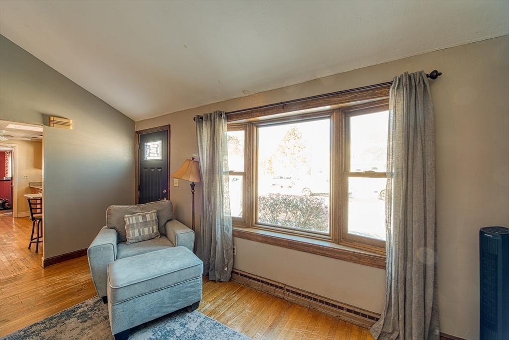 12 Brewster Road Randolph, MA 02368 - Photo 18 of 27 a living room with furniture and a window