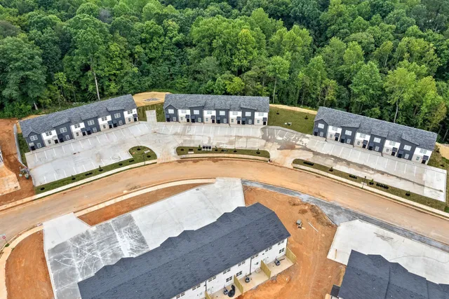 a view of swimming pool with a deck and a patio