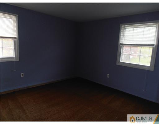 18 Edgewood Road Old Bridge, NJ 07747 - Photo 17 of 21 a view of an empty room and window