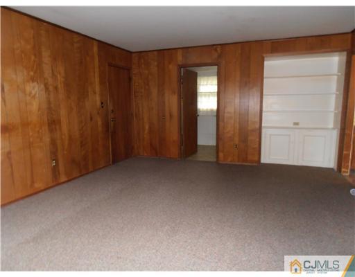 18 Edgewood Road Old Bridge, NJ 07747 - Photo 9 of 21 an empty room with windows