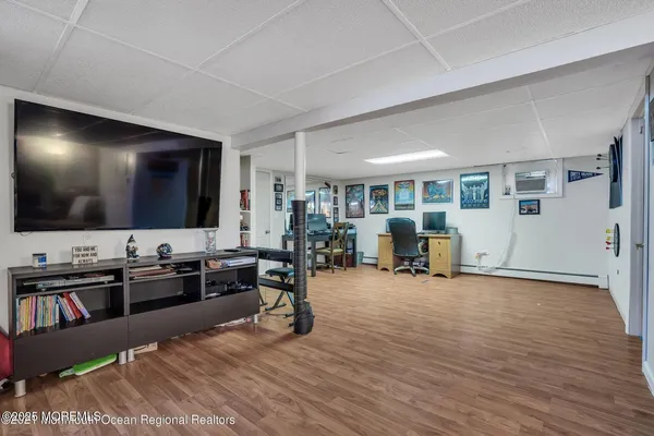 a view of a livingroom with furniture and a flat screen tv