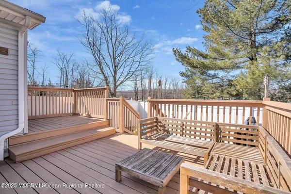 a view of a wooden roof with wooden floor and fence