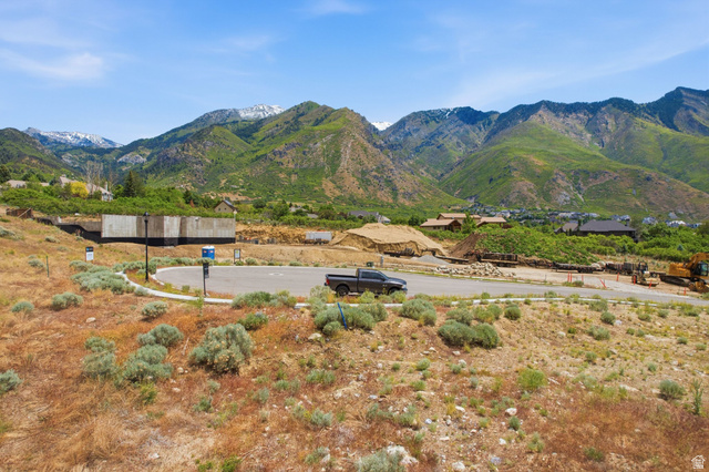 1817 North Dean Court, Unit 12 Alpine, UT 84004 - Photo 16 of 38 Mountainous terrain backdrop featuring a partial concrete foundation on a building site